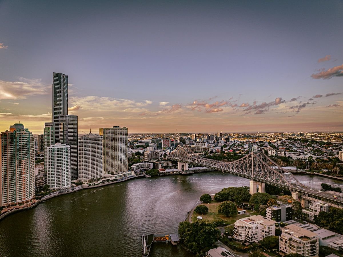 The Story Bridge over the Brisbane River with the city skyline at dusk